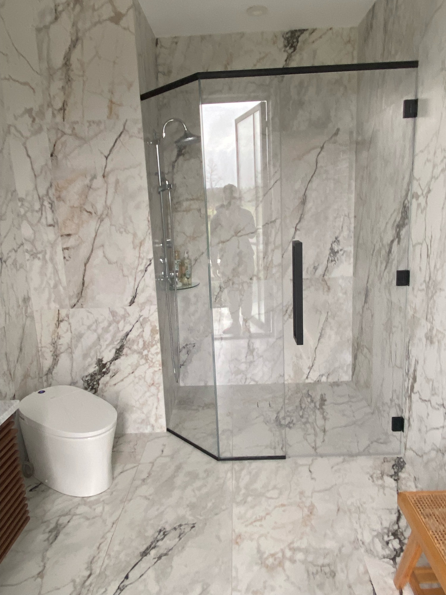 Modern marble bathroom remodeling project by Serge Construction